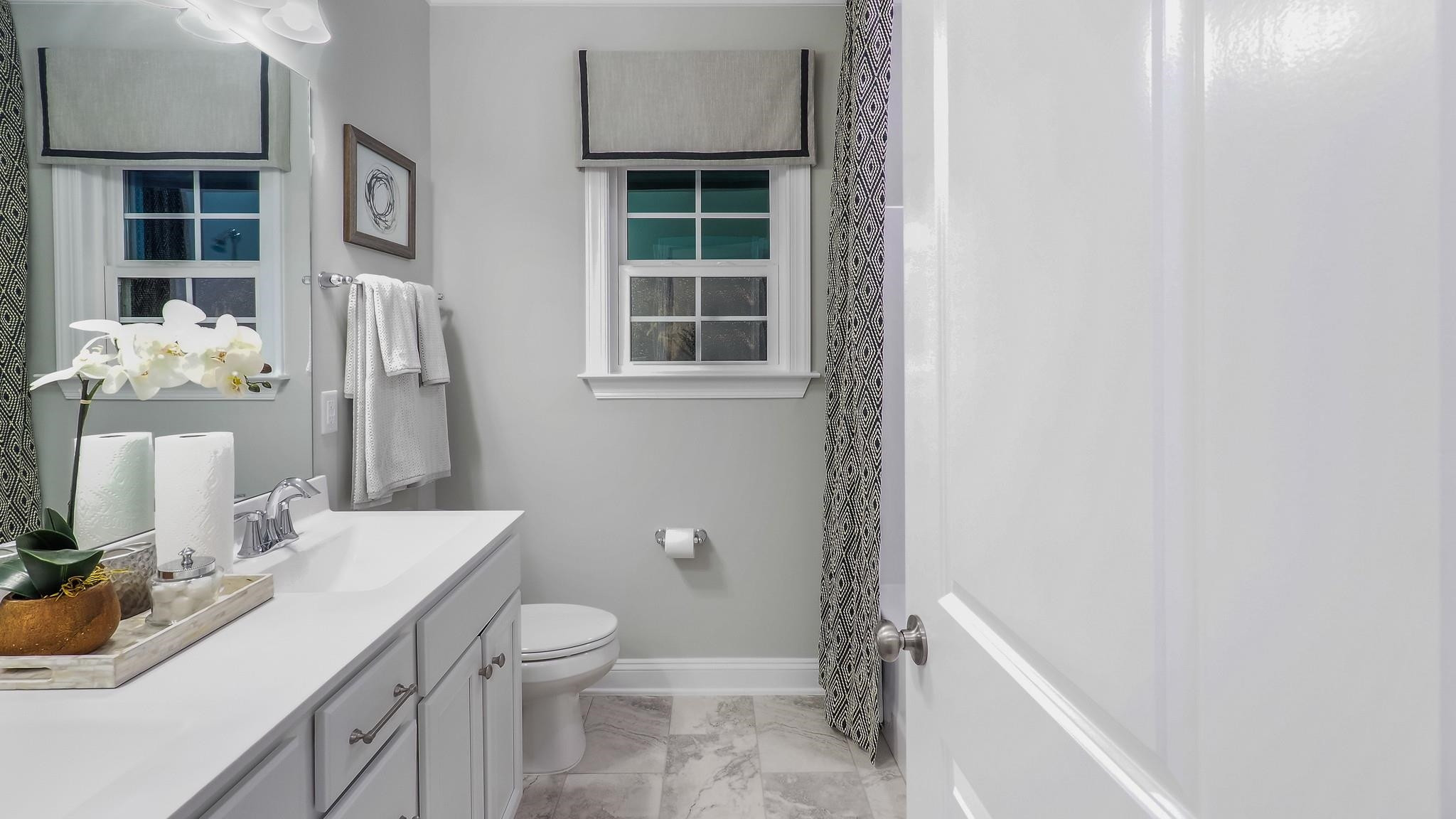4030 Frontrunner Drive, Unit 46 Durham, NC 27703 - Photo 23 of 25 a bathroom with a sink toilet and shower