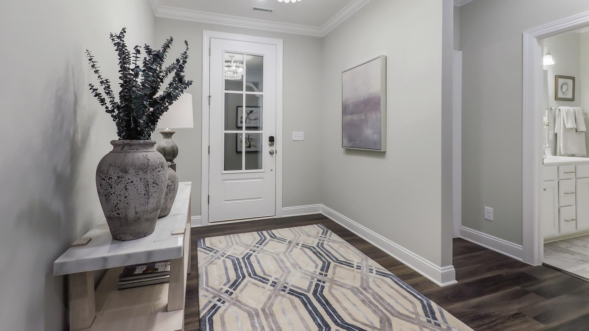 4030 Frontrunner Drive, Unit 46 Durham, NC 27703 - Photo 3 of 25 a living room with furniture and a potted plant