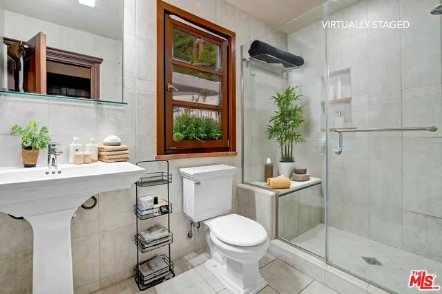 a work room with furniture lamp and book shelf