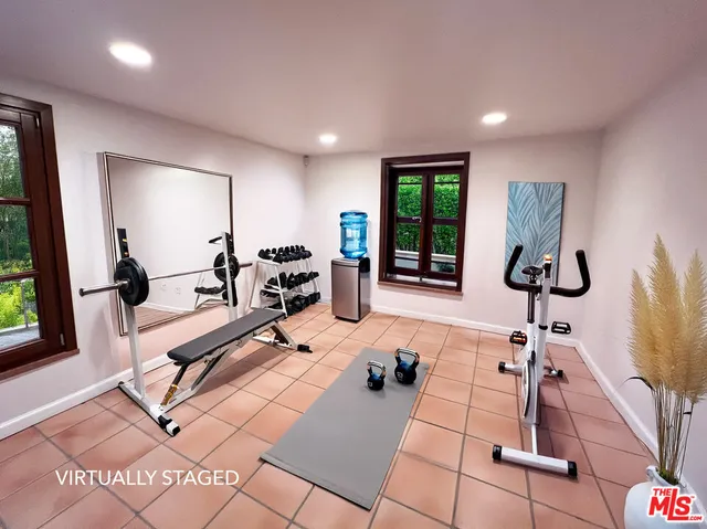 a kitchen with granite countertop a stove and a refrigerator