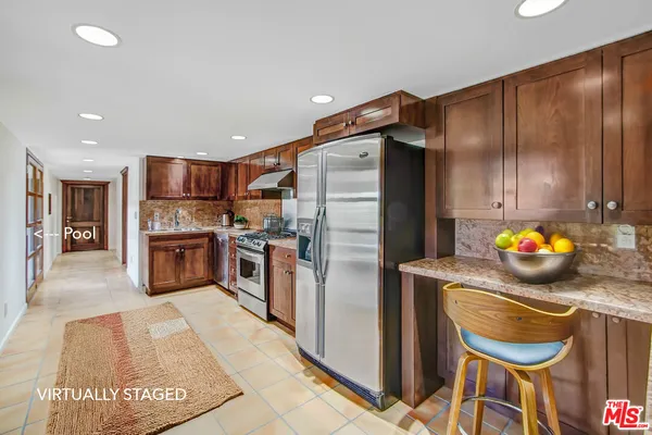 a lobby with furniture and floor to ceiling window