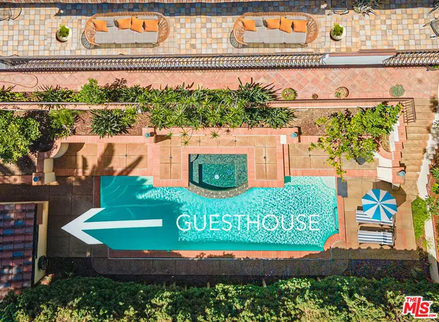 a kitchen with a refrigerator and white cabinets