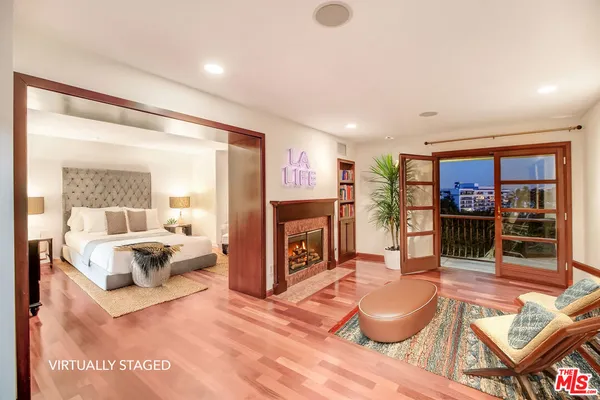 a bathroom with a sink toilet and mirror