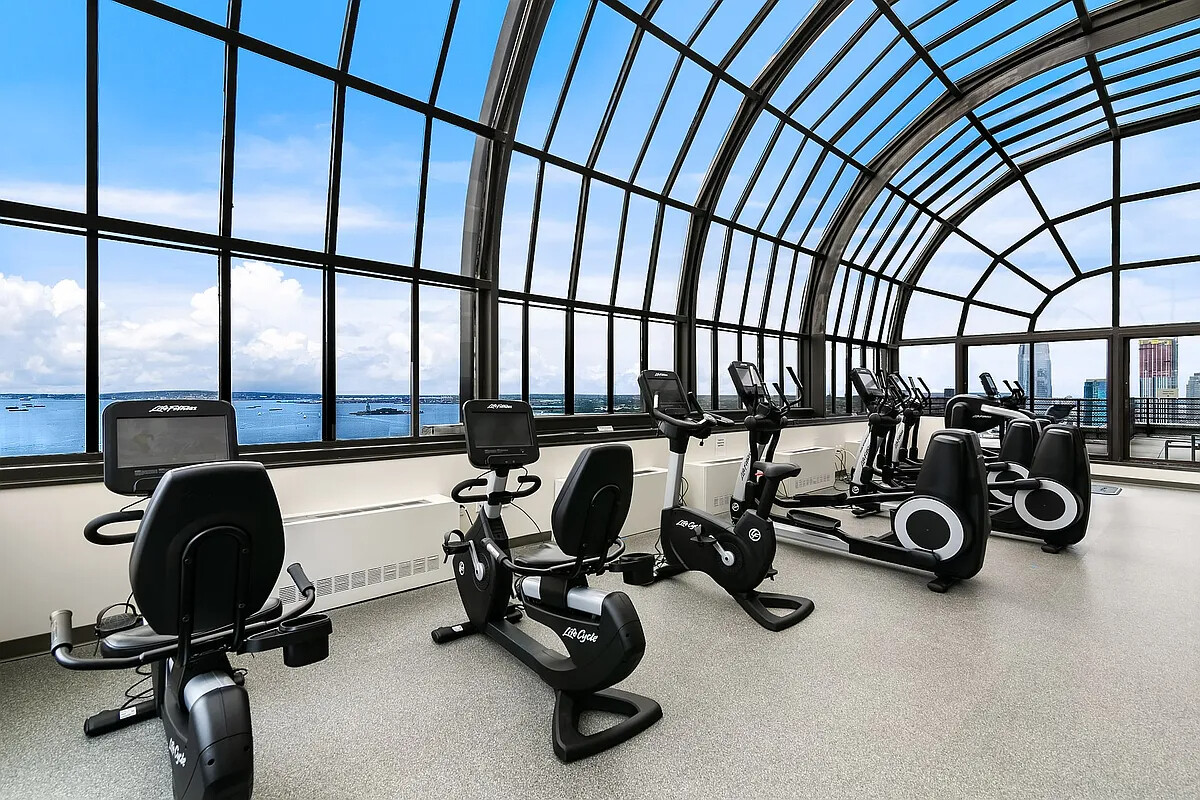 200 Rector Place, Unit 20J Manhattan, NY 10280 - Photo 10 of 13 a view of a room with gym equipment