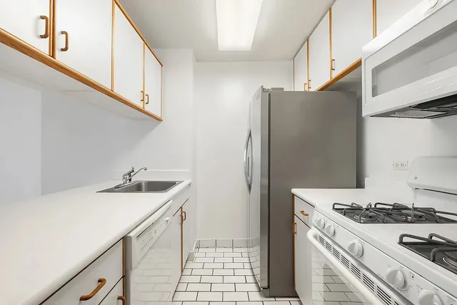 a bedroom with a large bed and a couch