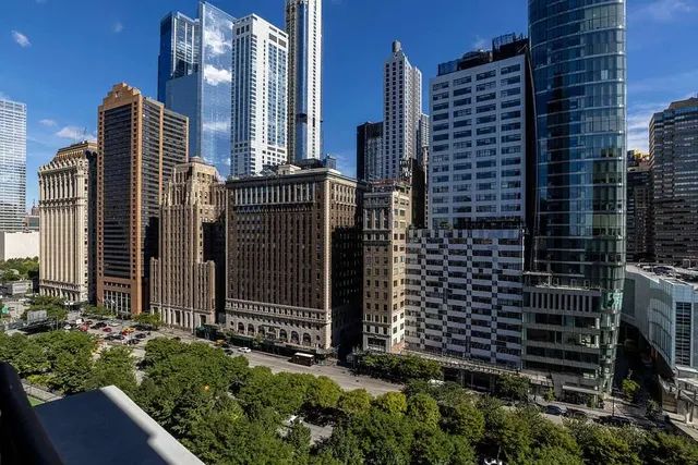 a kitchen with stainless steel appliances a white stove top oven a sink and dishwasher
