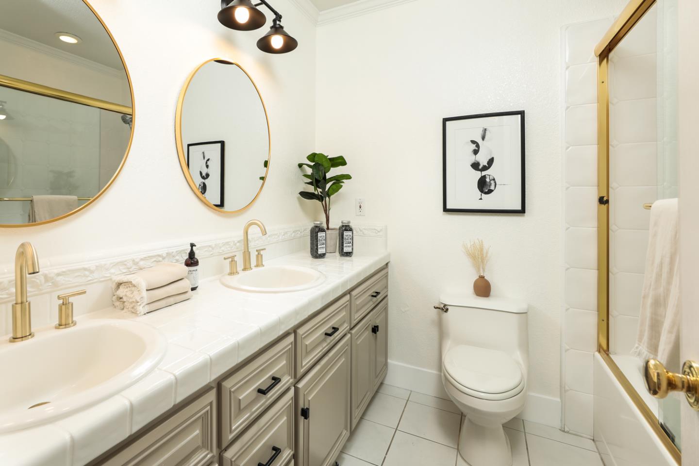 735 Ashbourne Drive Sunnyvale, CA 94087 - Photo 14 of 25 a bathroom with a sink a toilet and a mirror