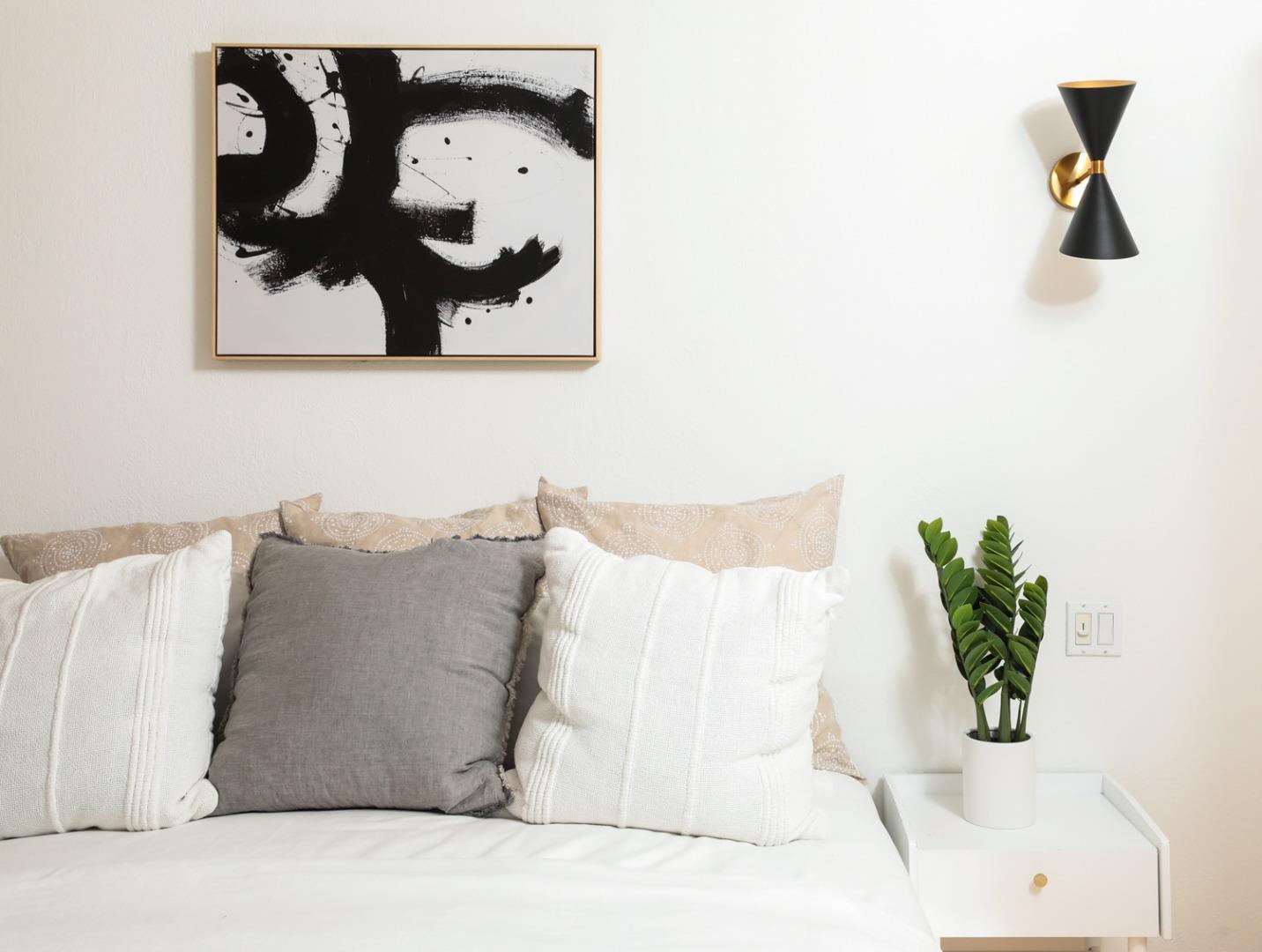 735 Ashbourne Drive Sunnyvale, CA 94087 - Photo 16 of 25 a bed with a white comforter and pillows