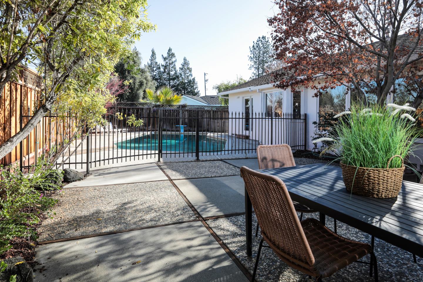 735 Ashbourne Drive Sunnyvale, CA 94087 - Photo 22 of 25 a view of backyard with seating space and trees
