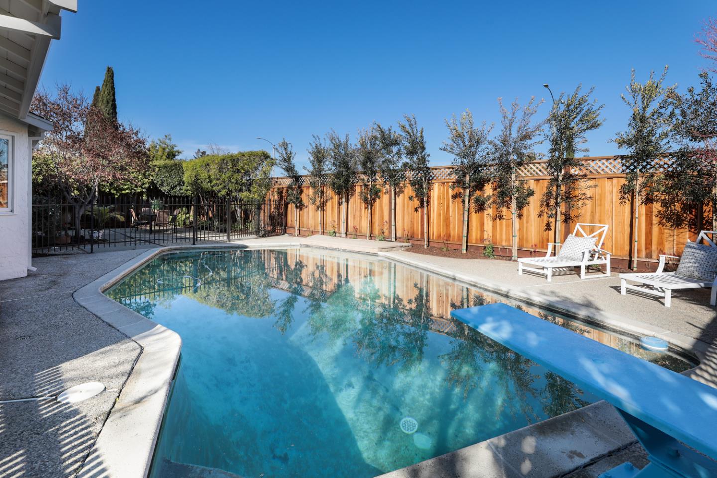 735 Ashbourne Drive Sunnyvale, CA 94087 - Photo 24 of 25 a view of a swimming pool with a patio