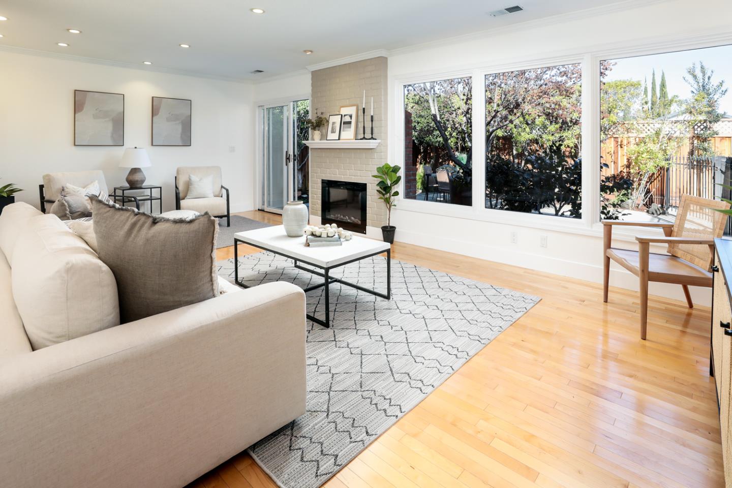 735 Ashbourne Drive Sunnyvale, CA 94087 - Photo 5 of 25 a living room with furniture and a fireplace