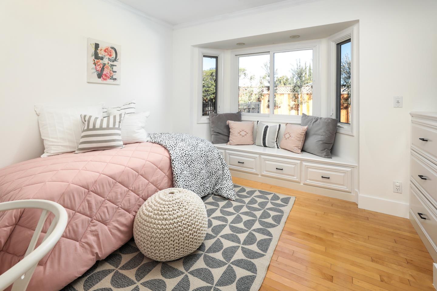 735 Ashbourne Drive Sunnyvale, CA 94087 - Photo 9 of 25 a bedroom with a large bed and a window