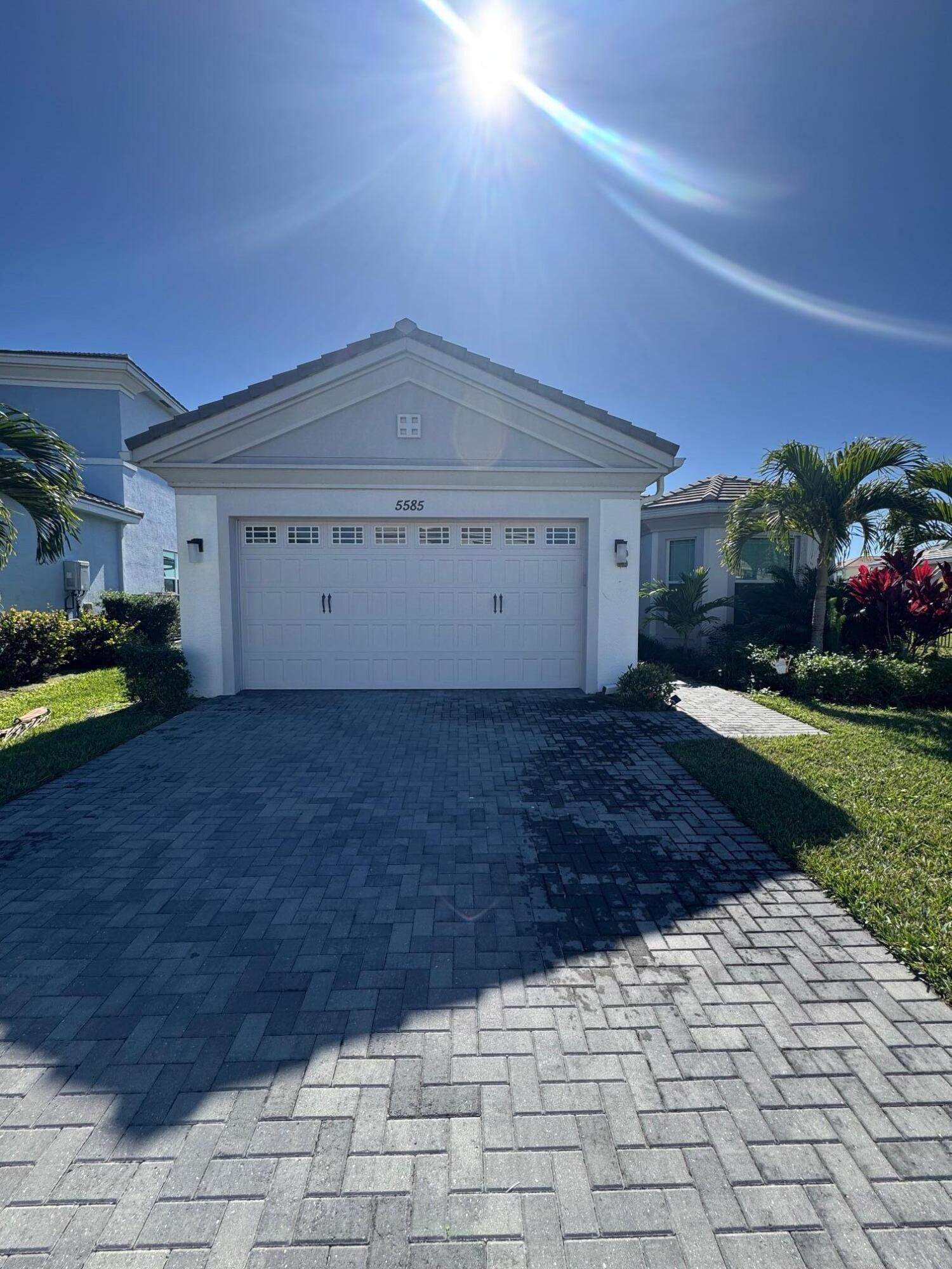 5585 Macoon Way, Unit 5585 Loxahatchee, FL 33470 - Photo 14 of 14 a view of a house with a yard