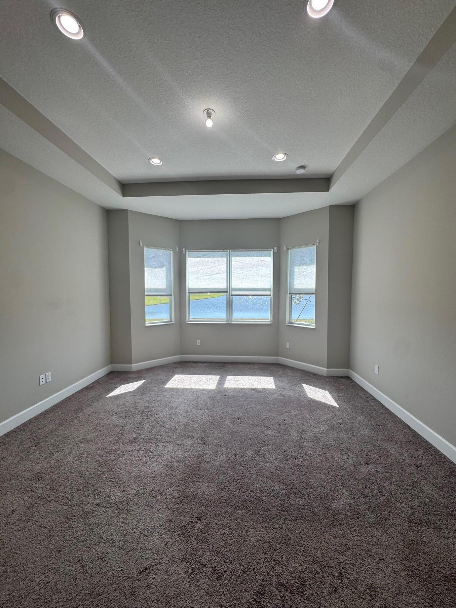 5585 Macoon Way, Unit 5585 Loxahatchee, FL 33470 - Photo 7 of 14 a view of empty room with a window