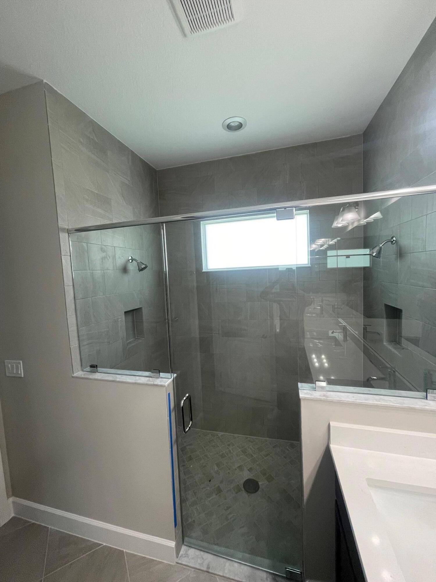 5585 Macoon Way, Unit 5585 Loxahatchee, FL 33470 - Photo 10 of 14 a bathroom with a shower