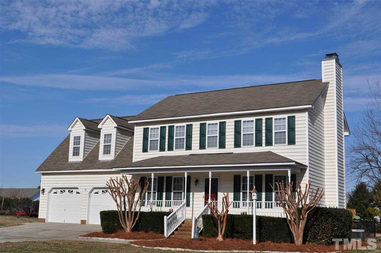 1113 Holland Ridge Drive Raleigh, NC 27603 - Photo 2 of 24 a front view of a building with balcony