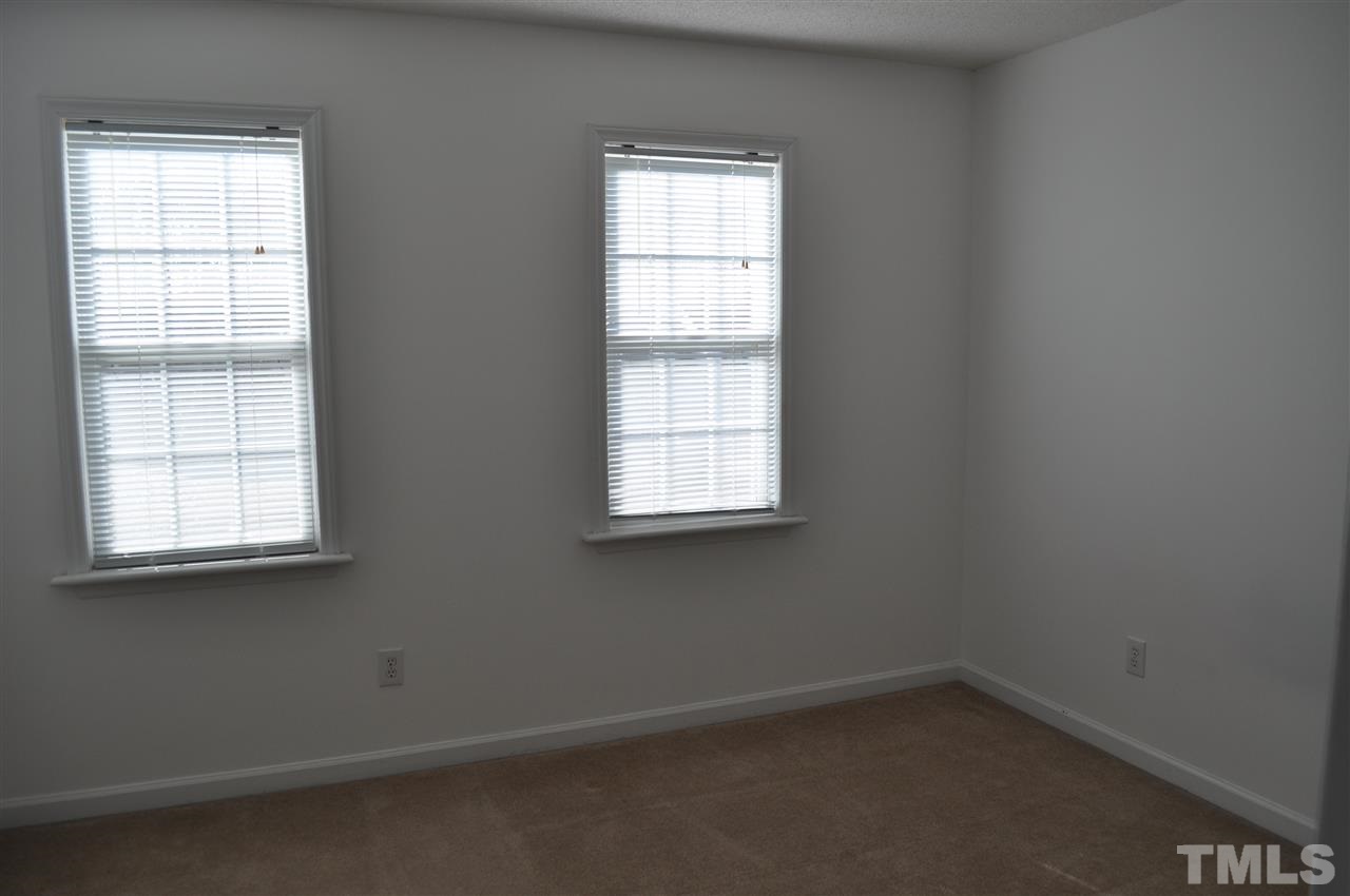 1113 Holland Ridge Drive Raleigh, NC 27603 - Photo 16 of 24 an empty room with a window