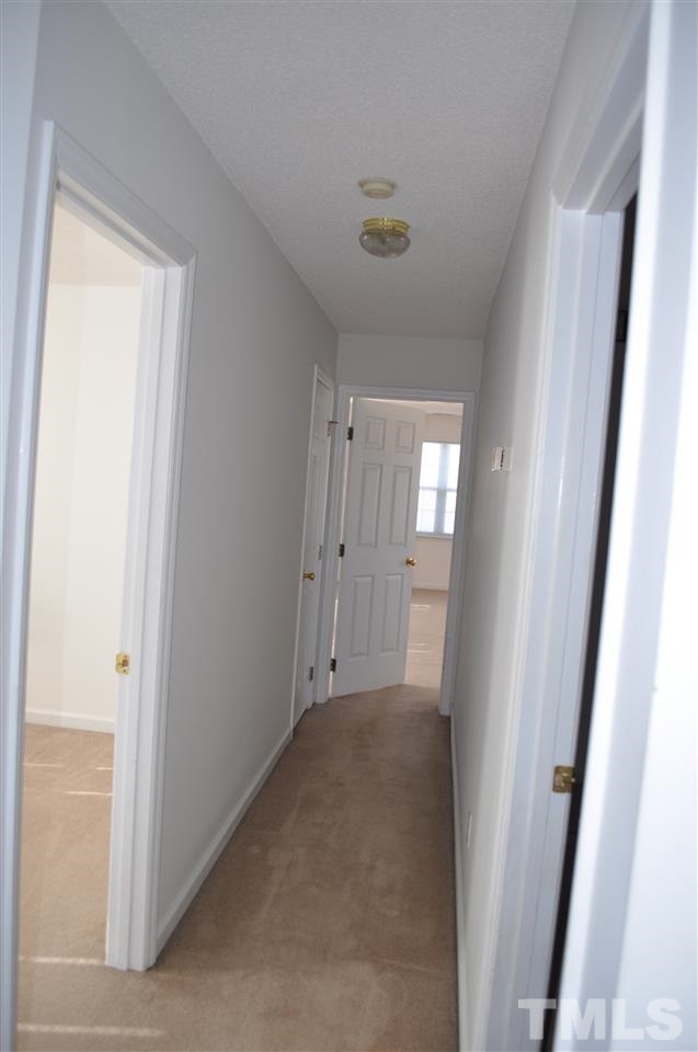 1113 Holland Ridge Drive Raleigh, NC 27603 - Photo 17 of 24 a view of hallway with window
