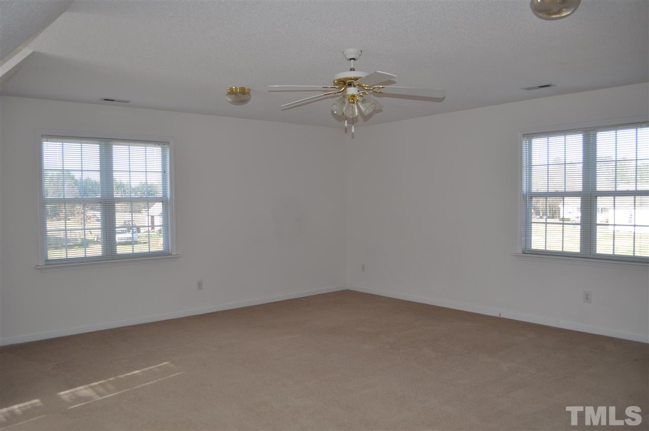1113 Holland Ridge Drive Raleigh, NC 27603 - Photo 19 of 24 an empty room with a window