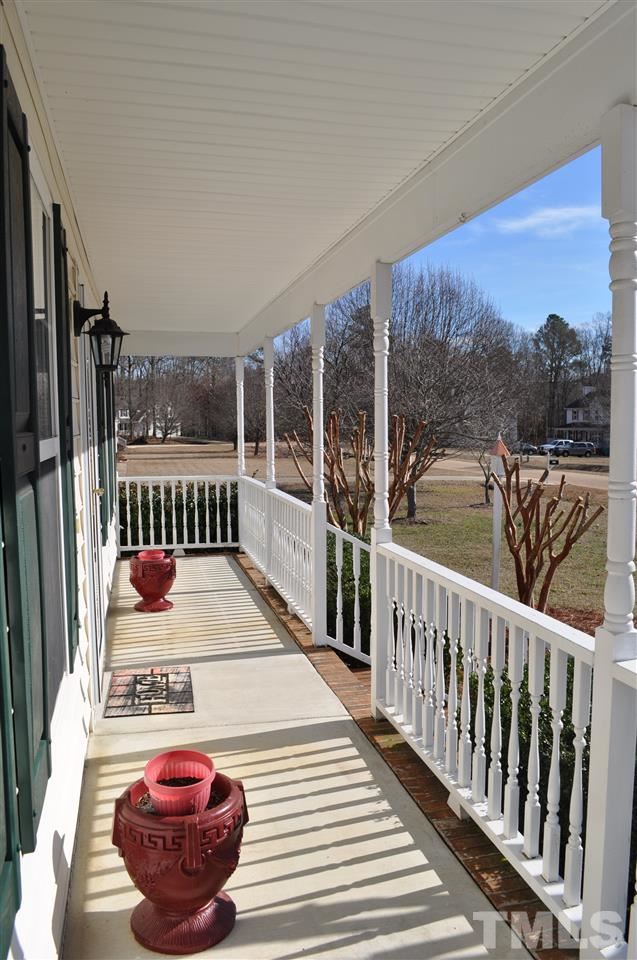 1113 Holland Ridge Drive Raleigh, NC 27603 - Photo 3 of 24 a balcony with furniture and wooden floor