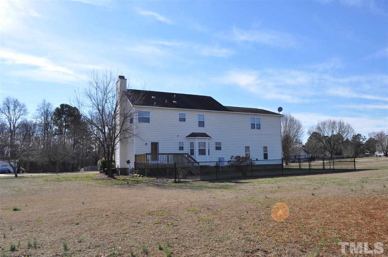 1113 Holland Ridge Drive Raleigh, NC 27603 - Photo 23 of 24 a front view of a house with a yard