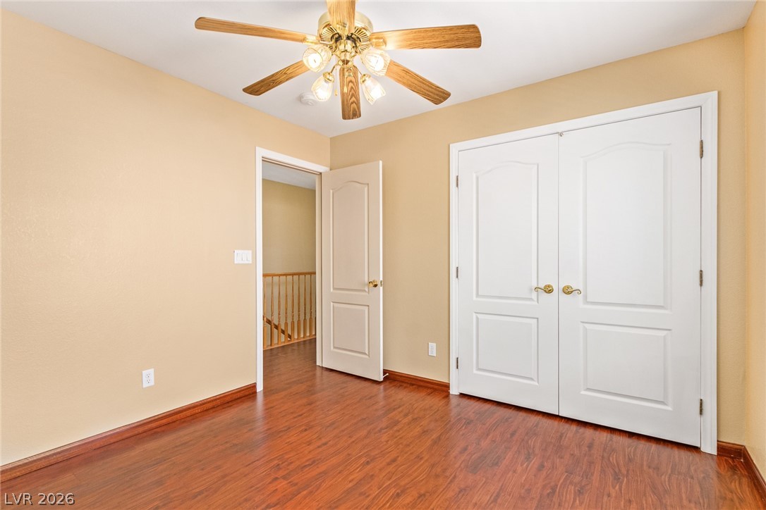 1477 Rancho Ridge Drive Henderson, NV 89012 - Photo 34 of 46 Hardwood floors and bright walls create a cheerful atmosphere in this flexible space.