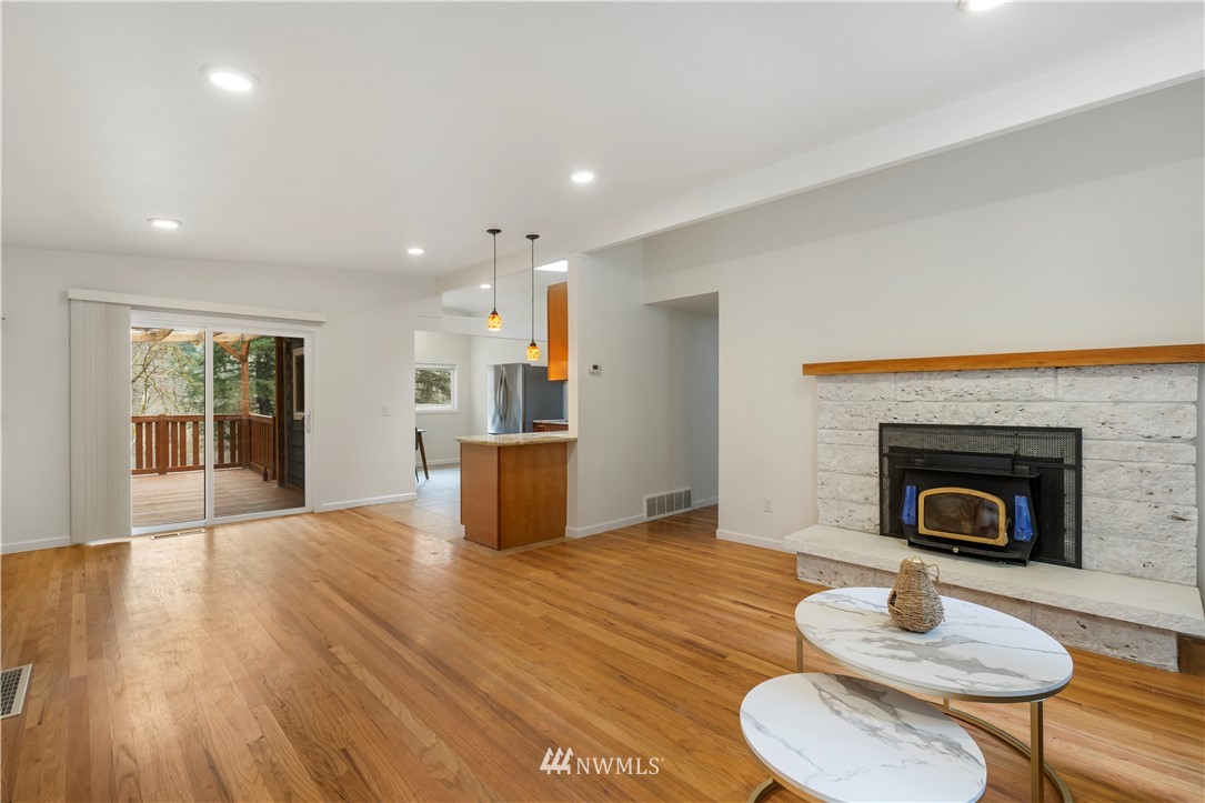 15612 Renton Issaquah Road Southeast Renton, WA 98059 - Photo 11 of 30 a living room with furniture and a fireplace