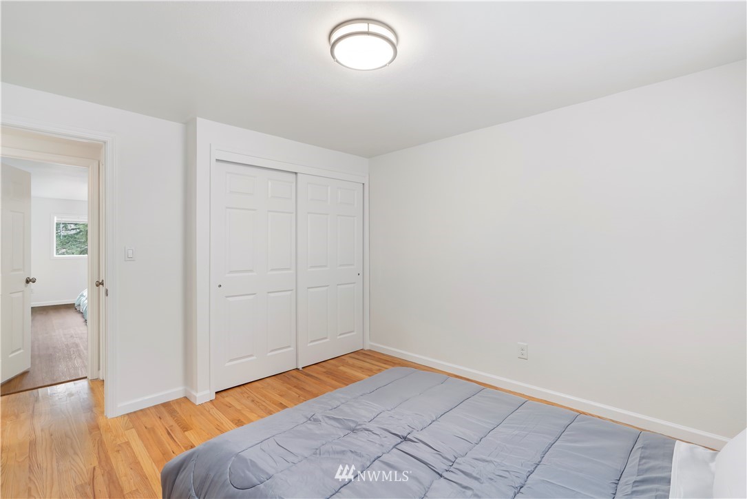 15612 Renton Issaquah Road Southeast Renton, WA 98059 - Photo 16 of 30 a view of a room with wooden floor and bathroom