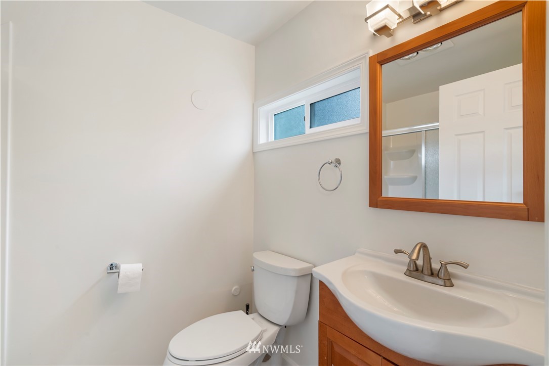 15612 Renton Issaquah Road Southeast Renton, WA 98059 - Photo 20 of 30 a bathroom with a sink and a mirror