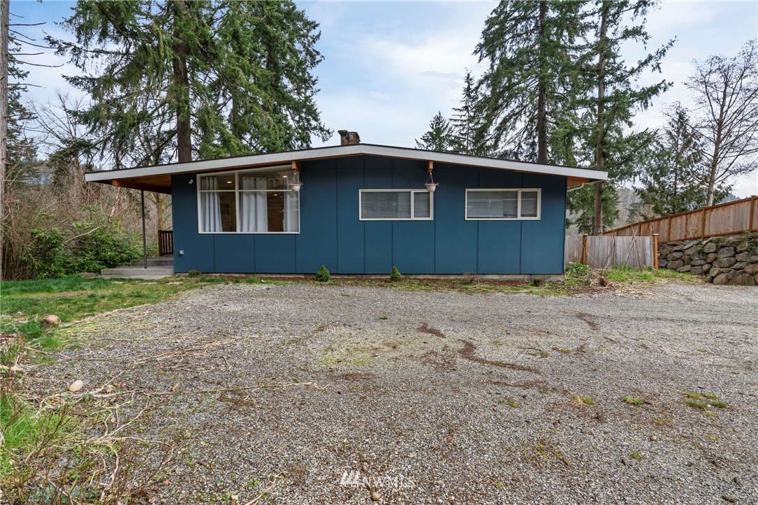 15612 Renton Issaquah Road Southeast Renton, WA 98059 - Photo 2 of 30 a front view of a house with a yard