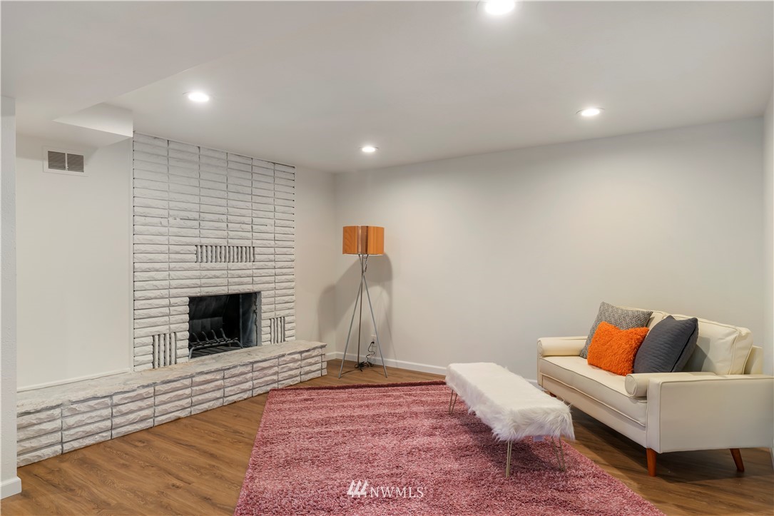 15612 Renton Issaquah Road Southeast Renton, WA 98059 - Photo 21 of 30 a living room with furniture and a fireplace