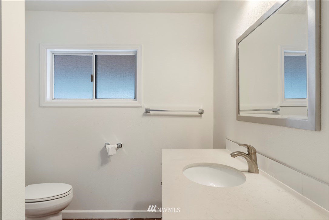 15612 Renton Issaquah Road Southeast Renton, WA 98059 - Photo 25 of 30 a bathroom with a sink and a mirror