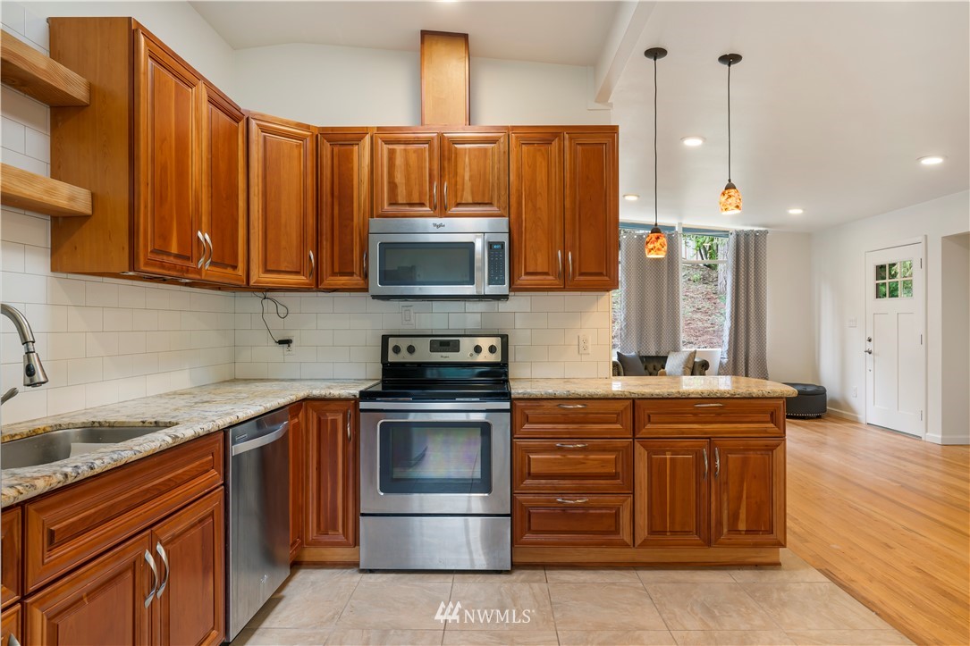 15612 Renton Issaquah Road Southeast Renton, WA 98059 - Photo 7 of 30 a kitchen with a stove and a sink