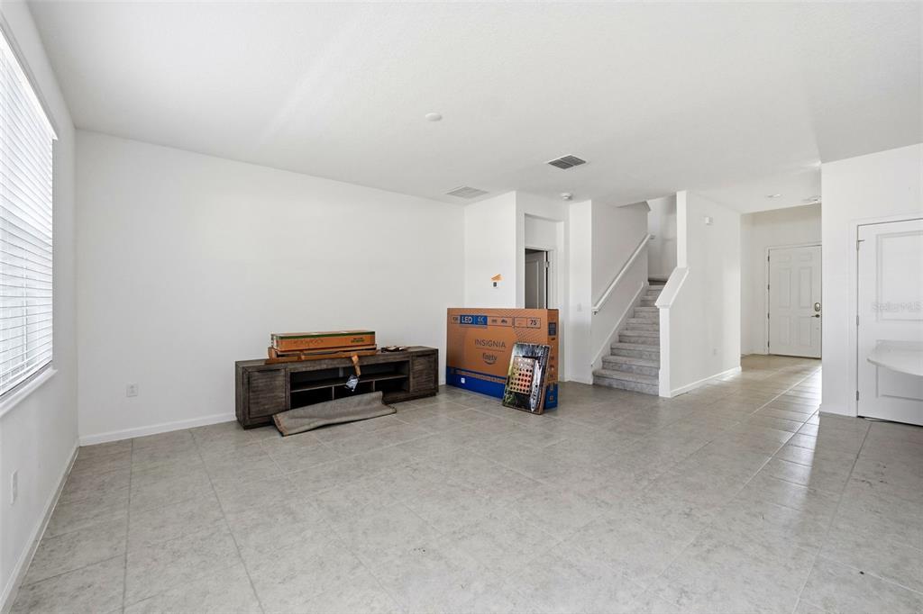 4483 Monado Drive Kissimmee, FL 34746 - Photo 17 of 43 a living room with furniture and a fireplace