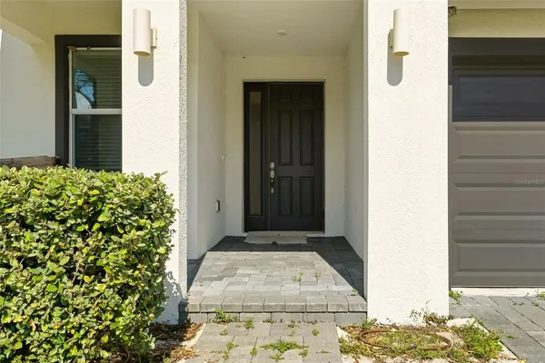 a view of a entryway door front of house