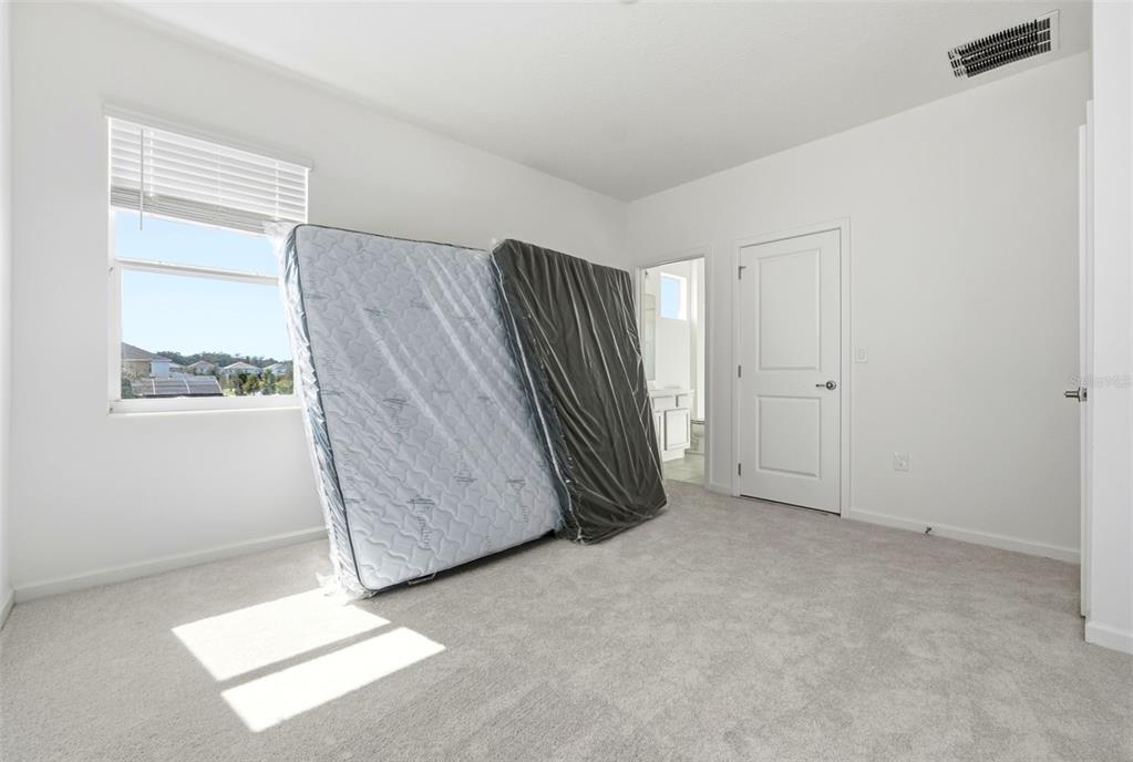 4483 Monado Drive Kissimmee, FL 34746 - Photo 36 of 43 an empty room with windows