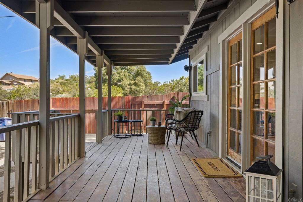 a view of a chairs and table on the deck