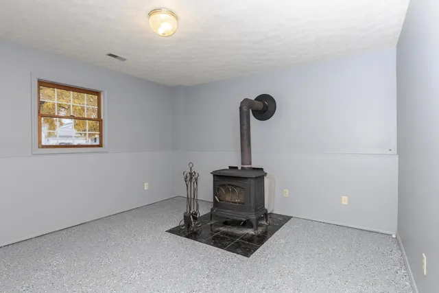 a room with a stove and a window