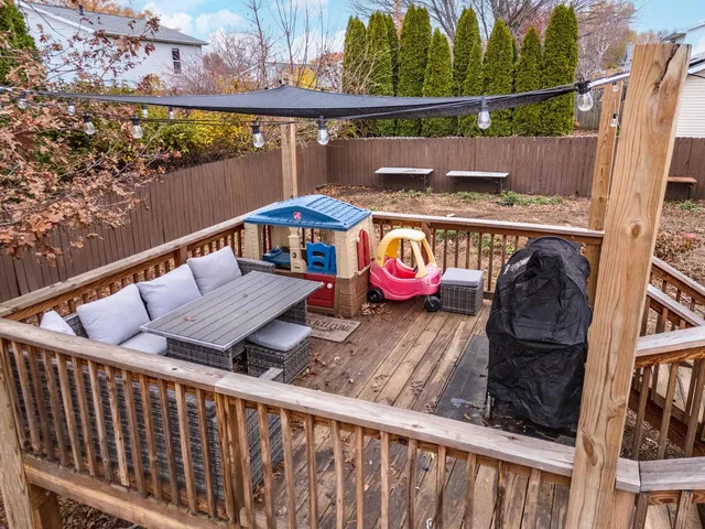 a view of balcony with furniture