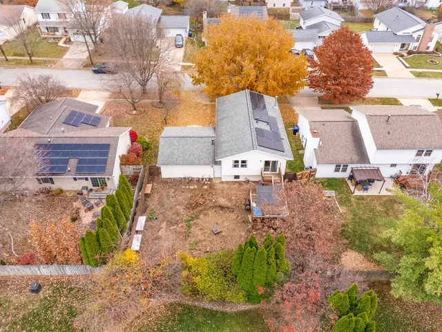 a view of multiple houses with a yard