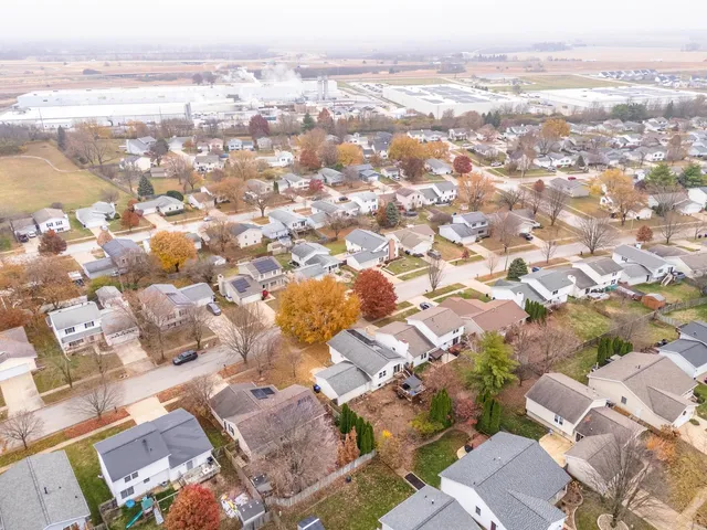 an aerial view of residential building with parking