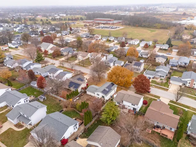 an aerial view of residential houses with outdoor space