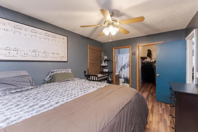 a bedroom with a bed and a walk in closet