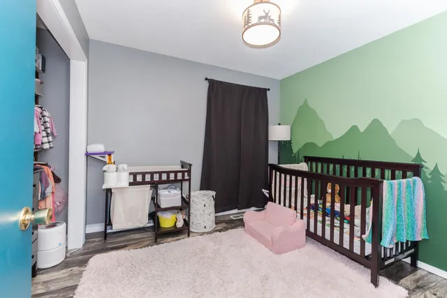 a bedroom with furniture and a window