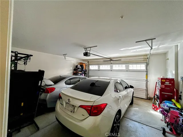 a room with gym equipment and a flat screen tv