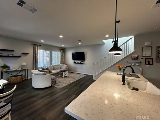 a bathroom with a sink a mirror and a window