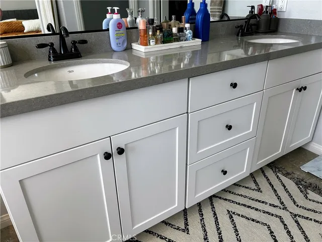 a view of cabinets a washer and dryer
