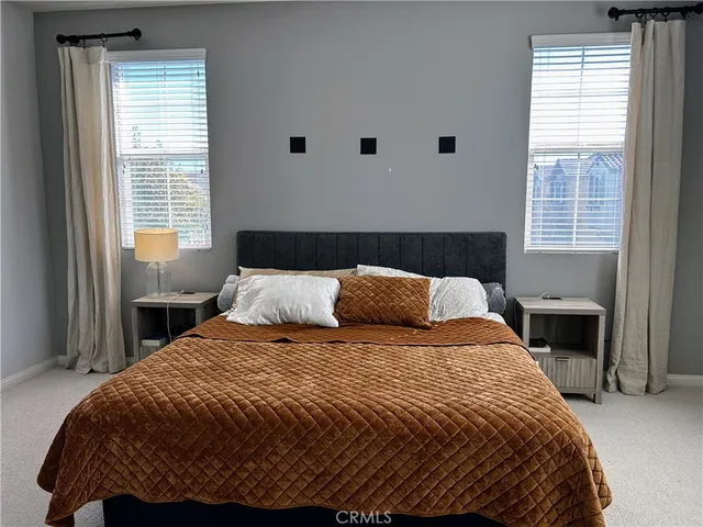 a room with gym equipment on wooden floor