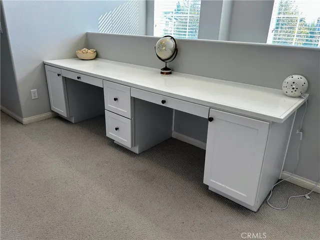 a bathroom with a double vanity sink and mirror