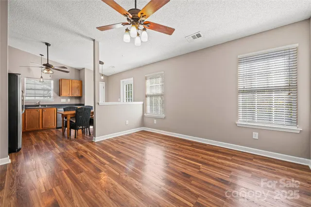 a view of livingroom with hardwood floor and a ceiling fan